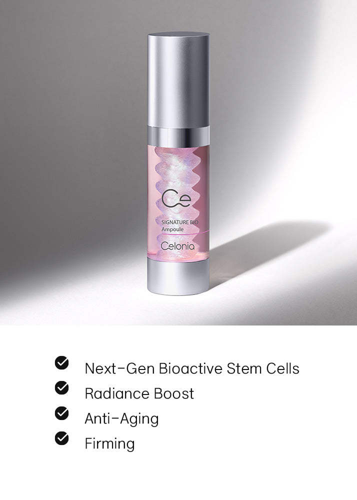Skincare serum bottle with brand name on a gray background