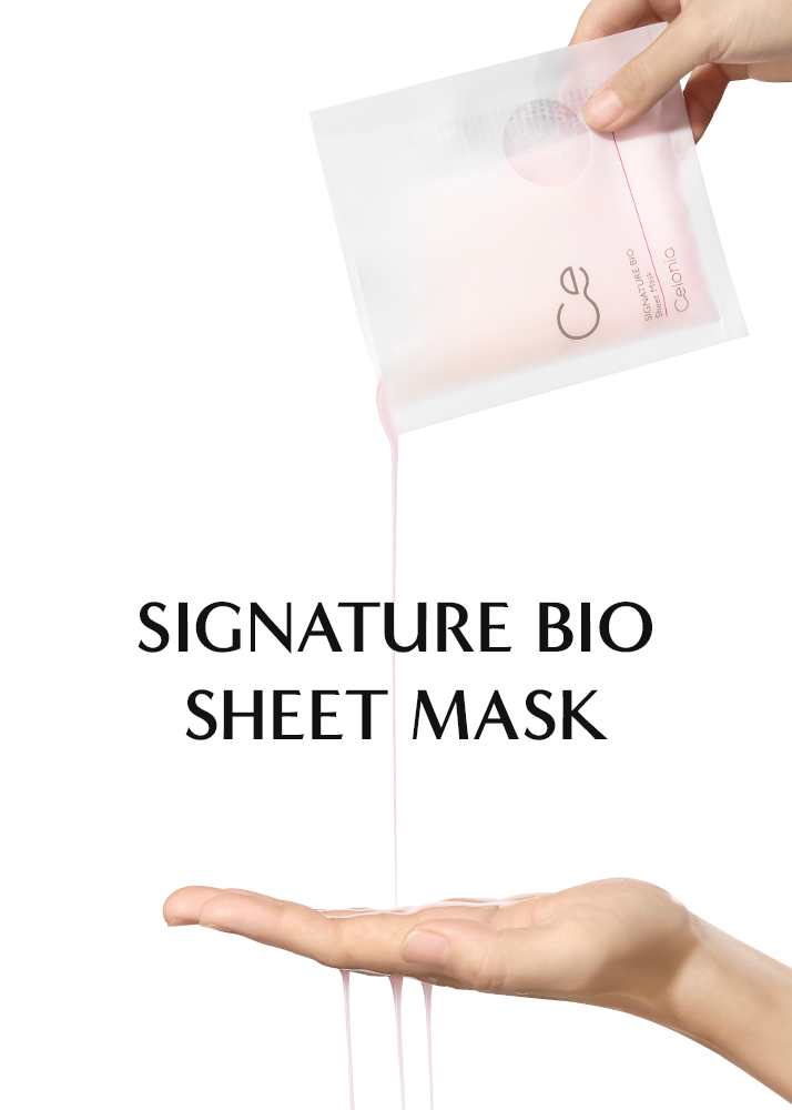 Signature Bio sheet mask being held above a hand with a white background