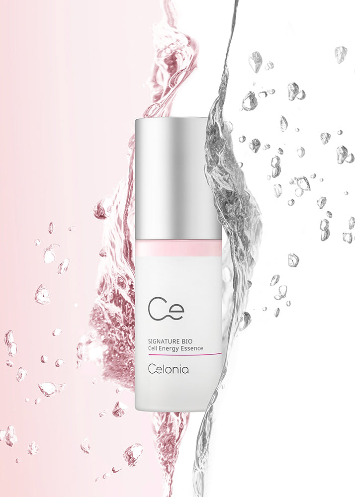 Celonia skincare bottle with water droplets on a pink background