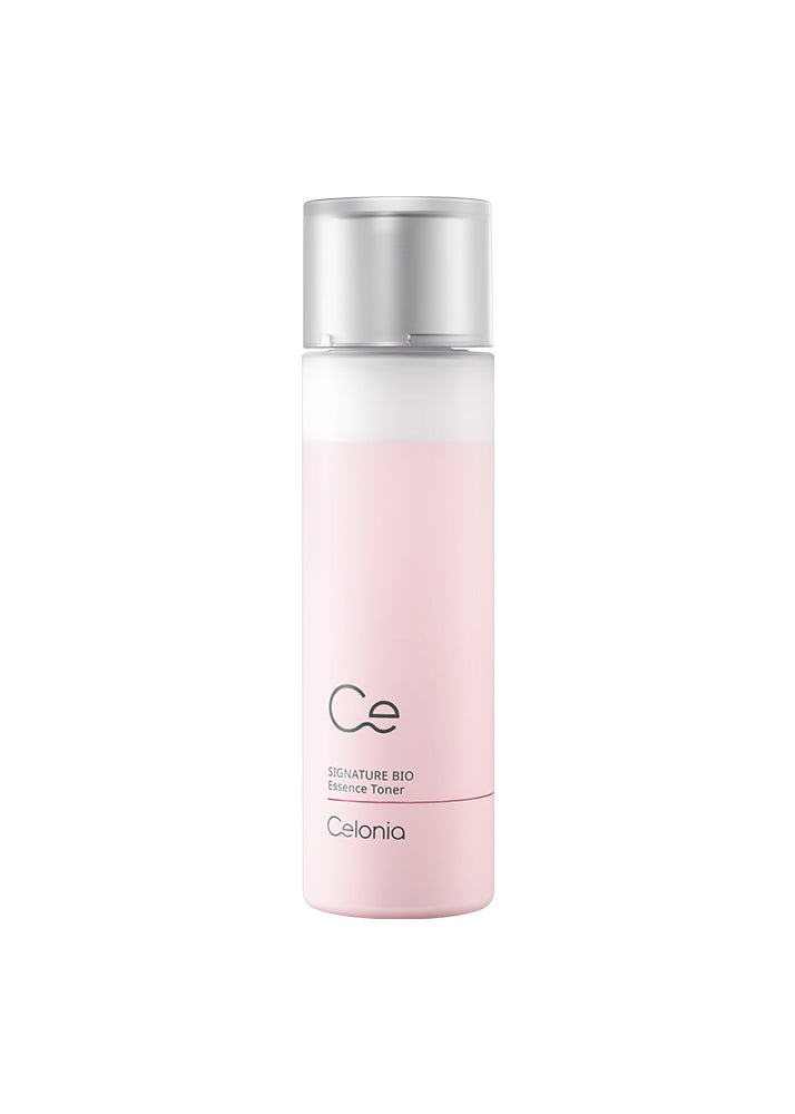Skincare bottle with pink gradient and silver cap on a white background