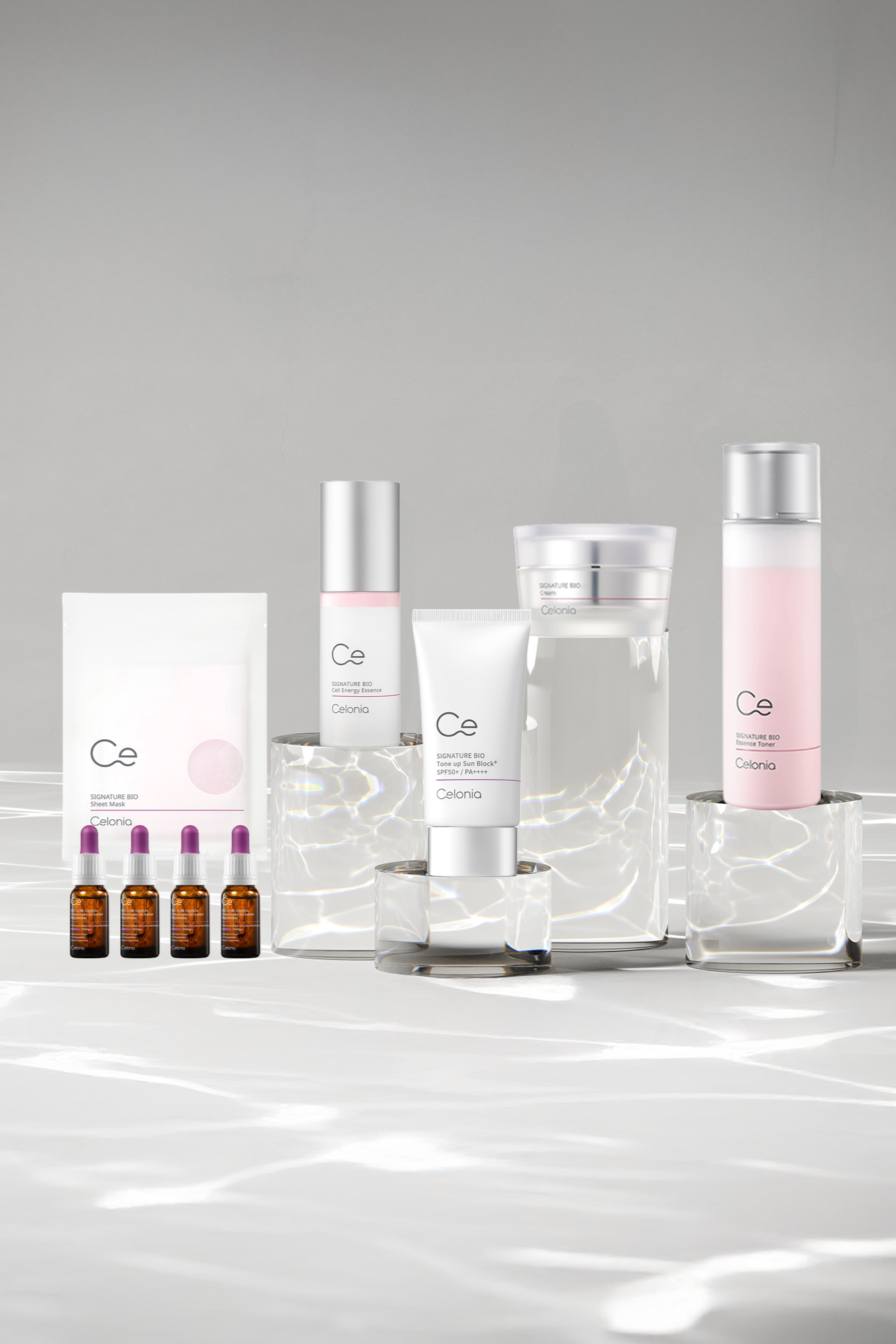 Cosmetic product set with bottles and packaging on a gray background
